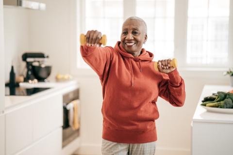 older woman with weights